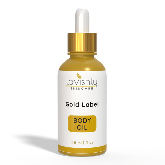 A bottle of Gold Label Nourishing Body Oil with a dropper, labeled with the brand and product name, against a white background.